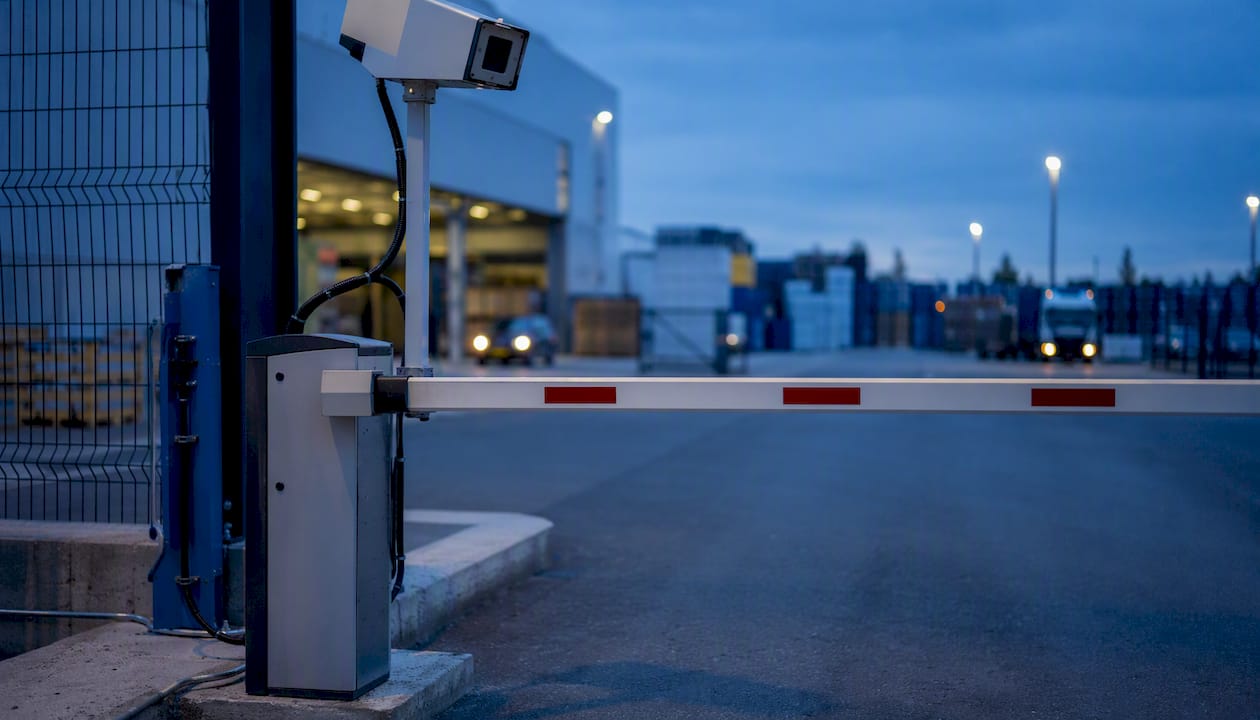Automated gate barrier and sensor in logistics yard