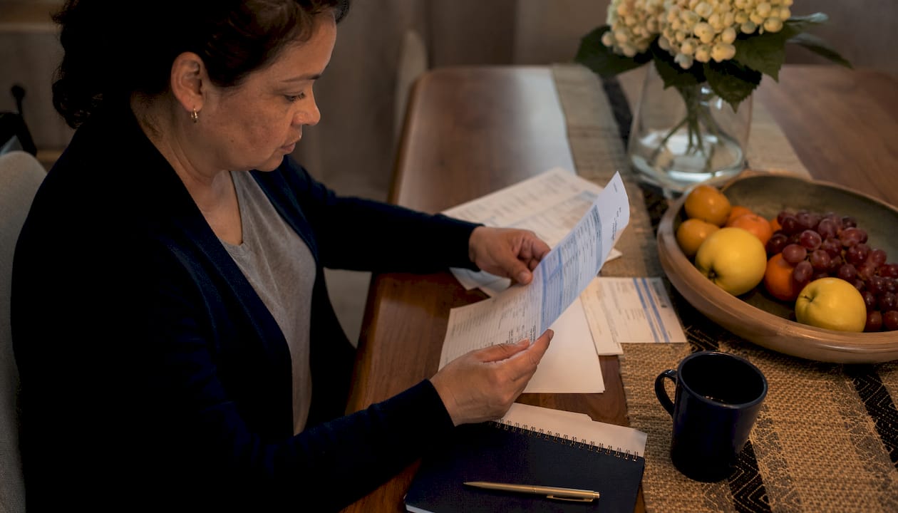 Middle-income retiree managing finances at home office