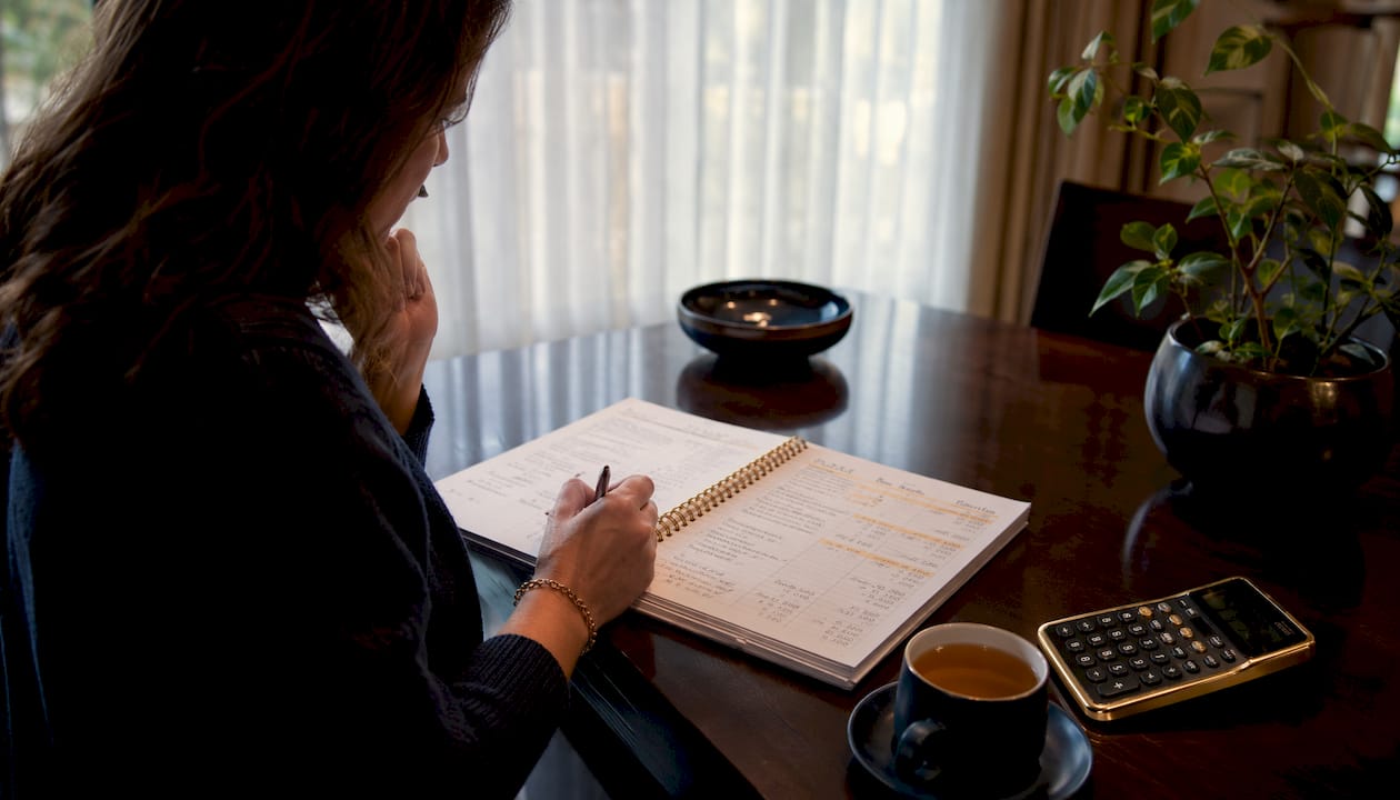 Close-up of hands reviewing Roth ladder calculations