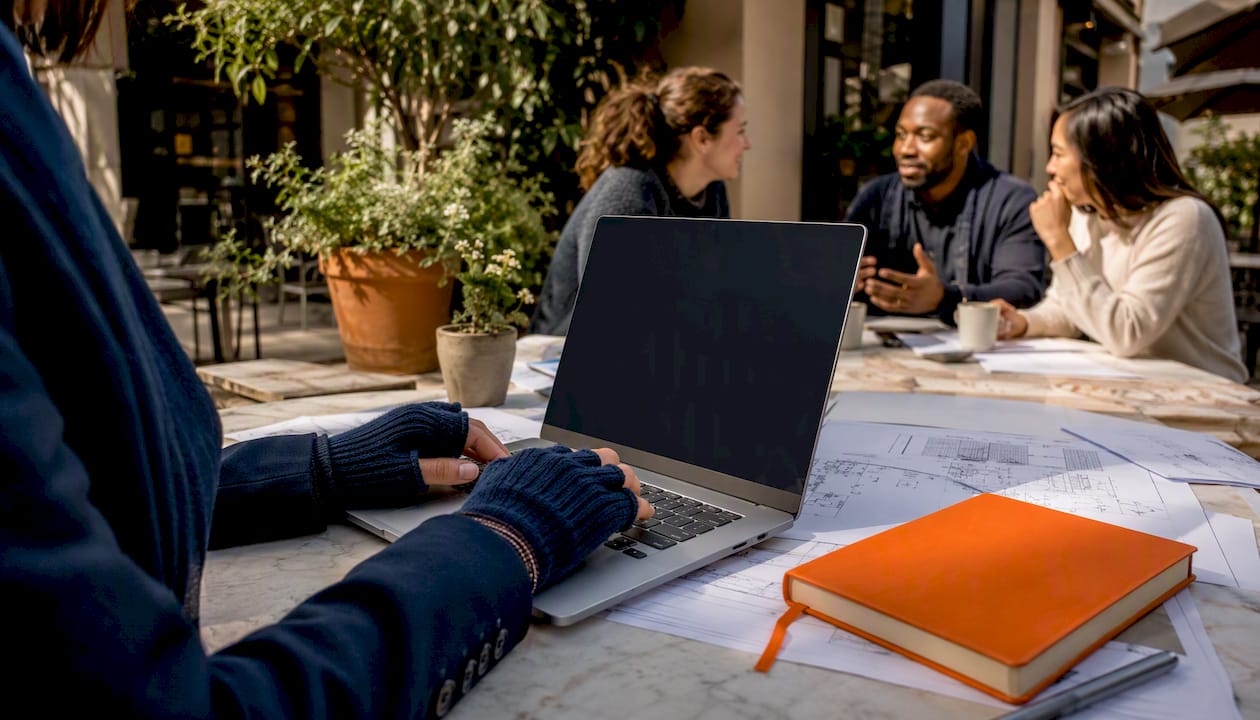 Hands typing audit analytics data in coworking space