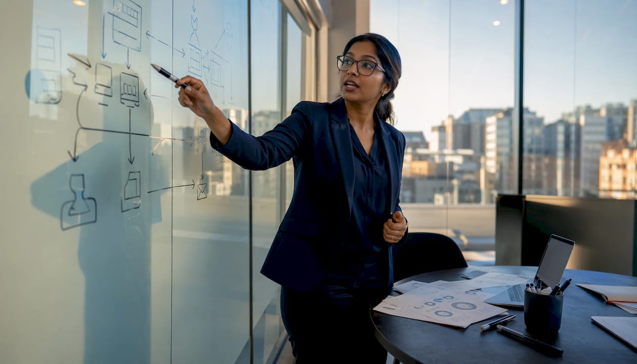 Cybersecurity analyst pointing to attack diagram