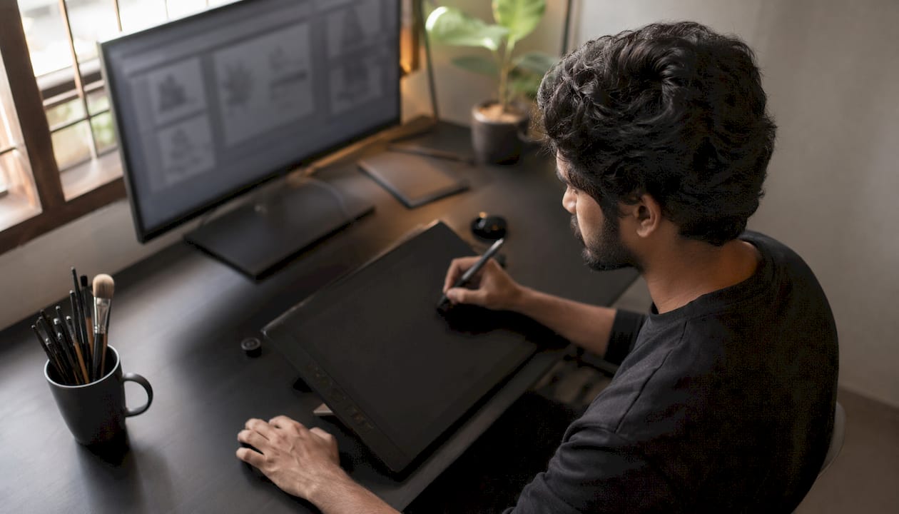 Animator working on digital storyboard in modern office