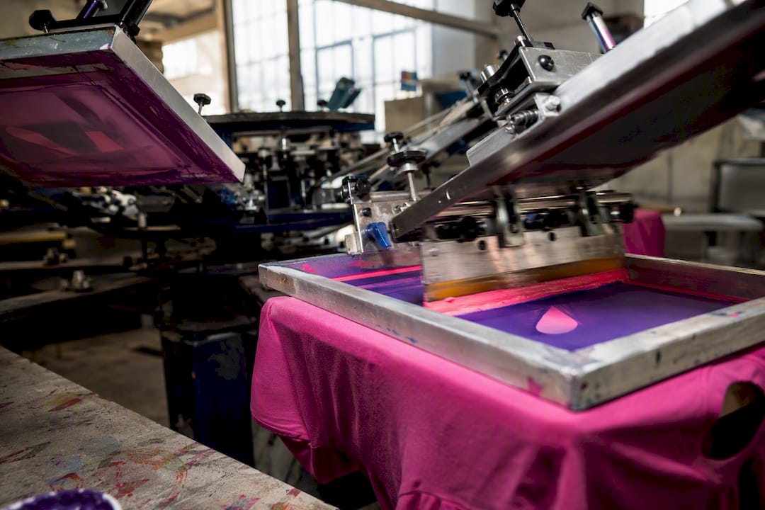 Automatic screen printing press in action