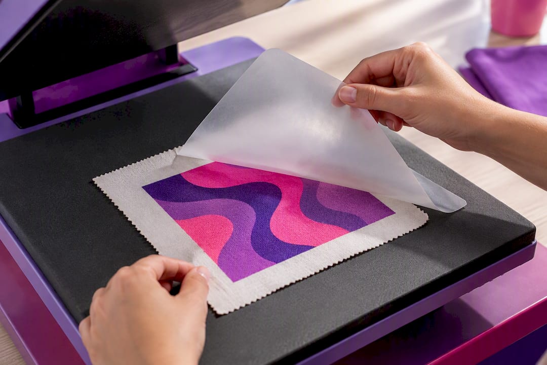 Hands inspecting a freshly cured print