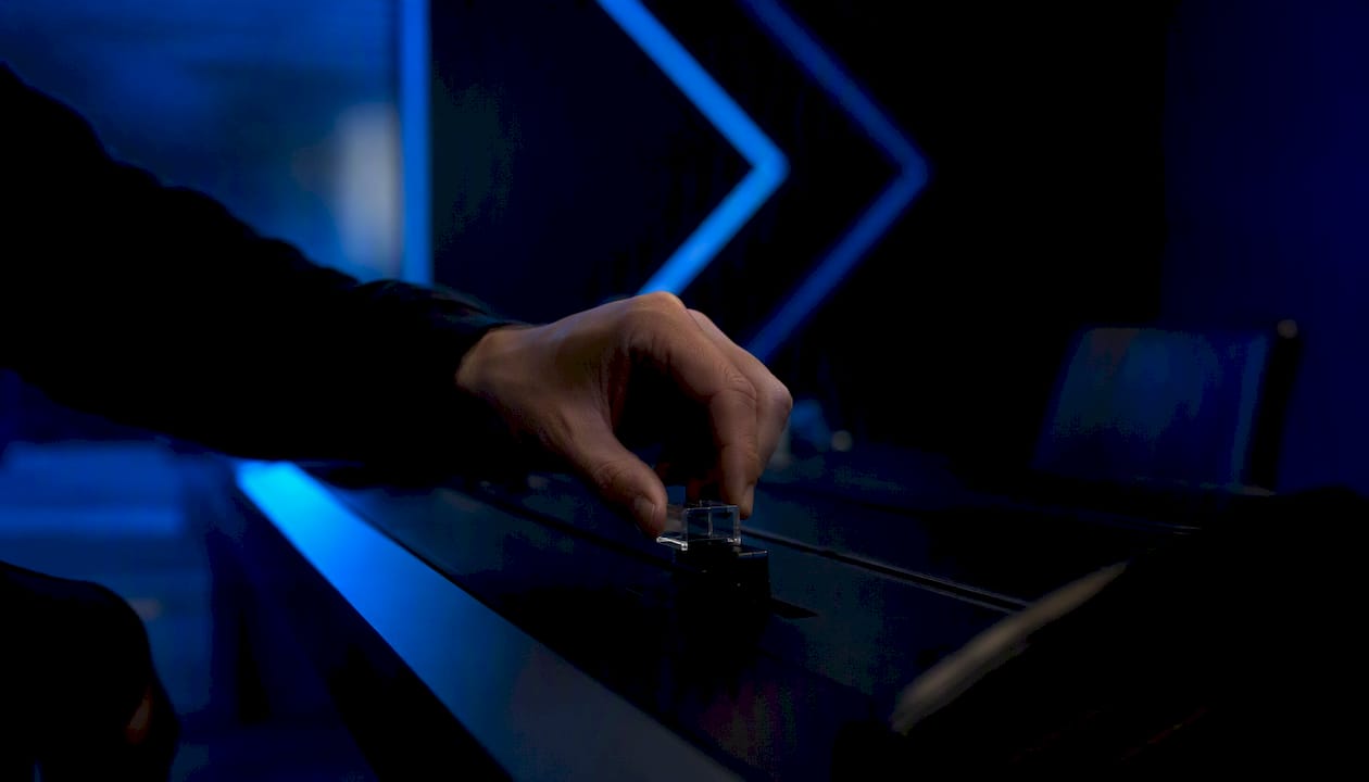 Hand holding security token near trading controller