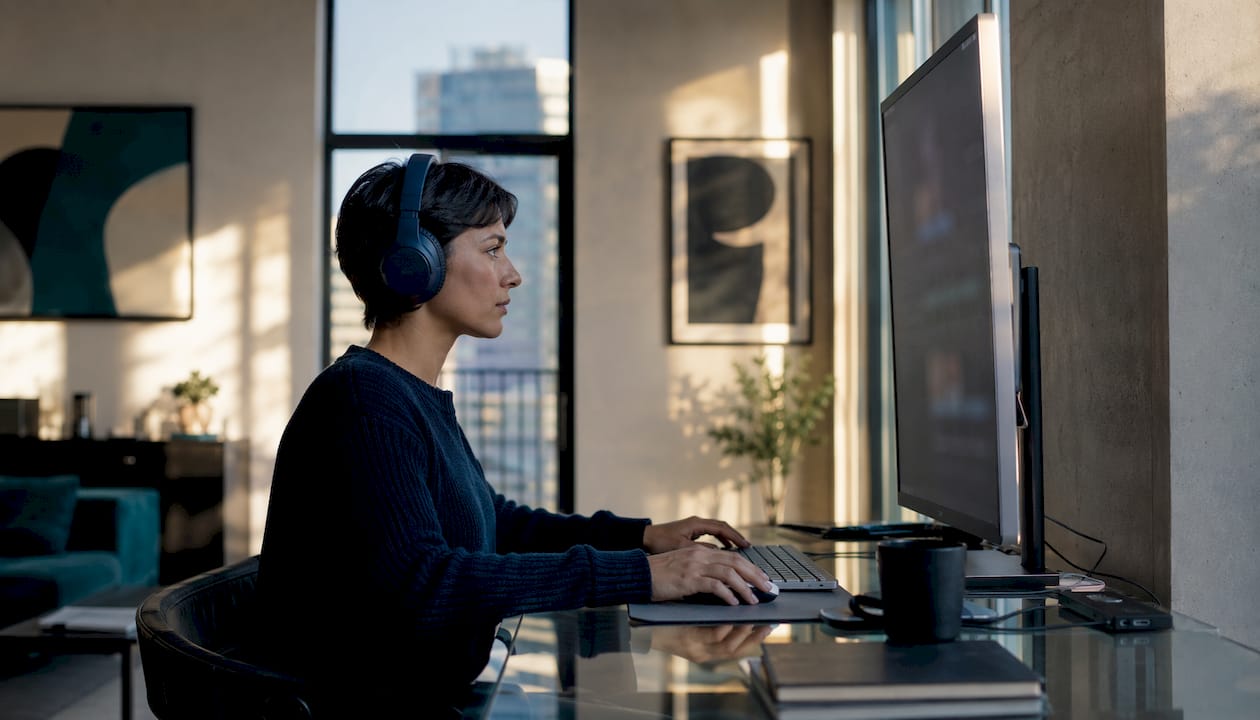 Woman using avatar video platform at desk