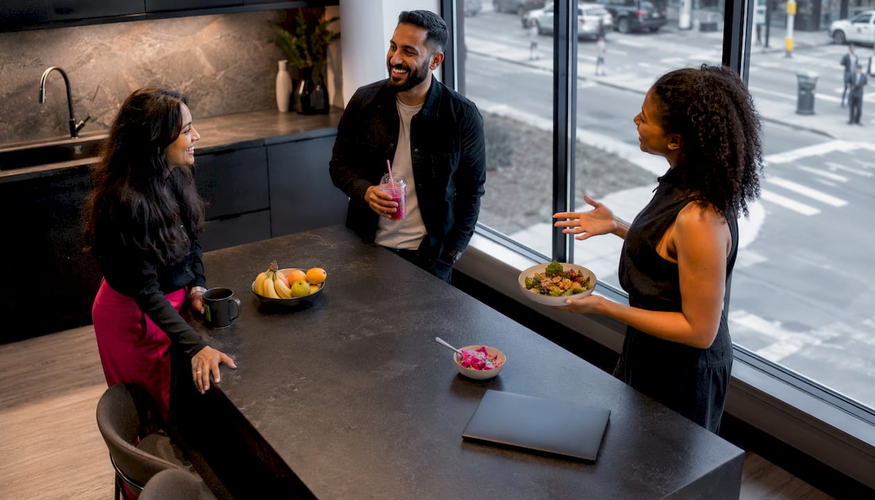 Coworkers chatting during office lunch break