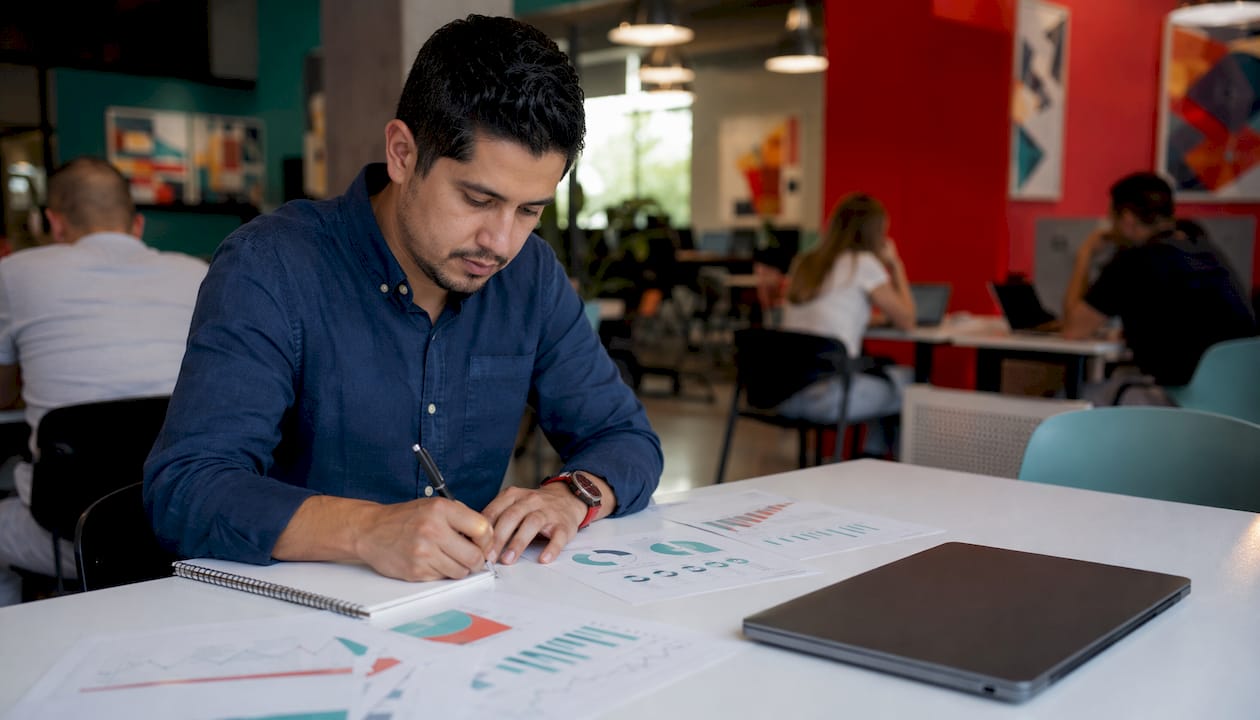Man reviewing NPS quarterly trends in private office