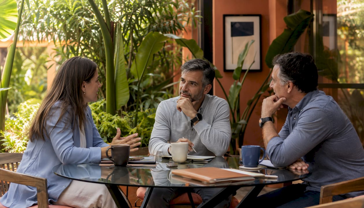 Two professionals discussing in mid-size private office
