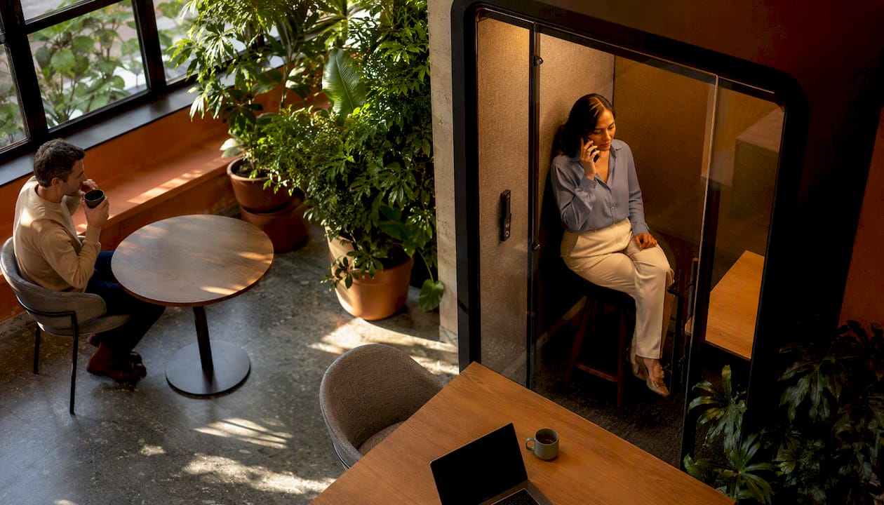 Woman respecting privacy in hot desk office