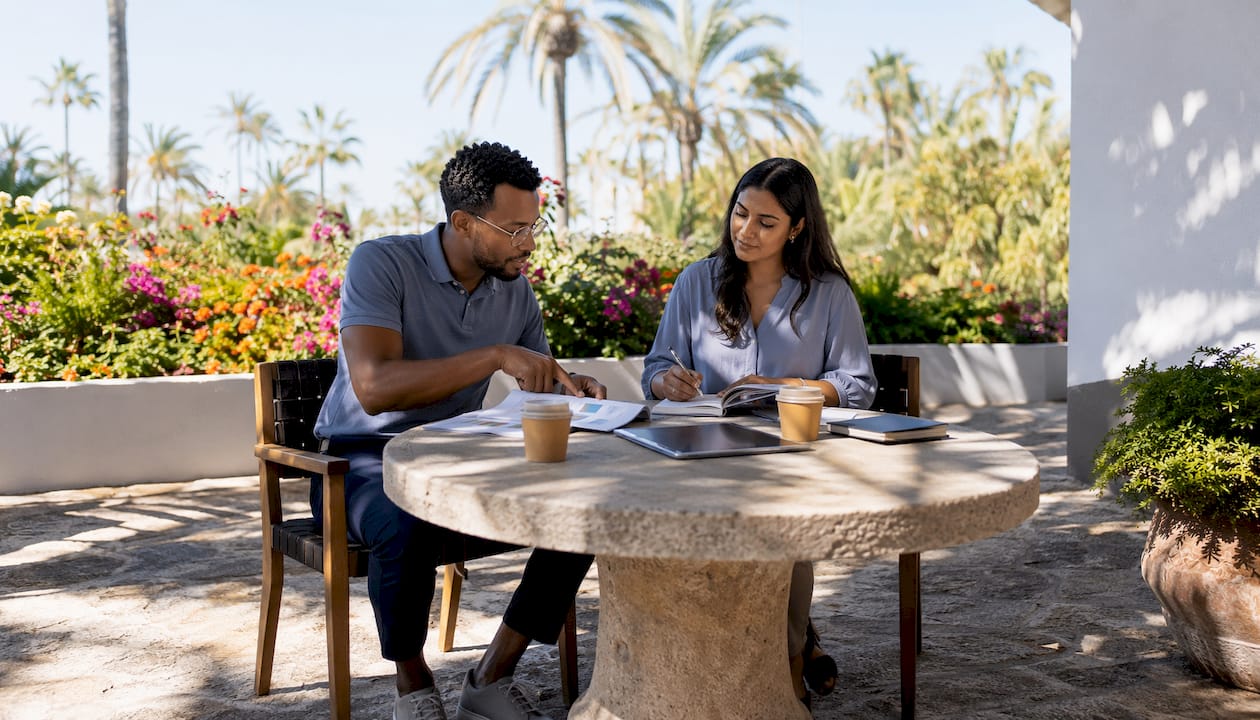 Two professionals collaborating in coworking hub