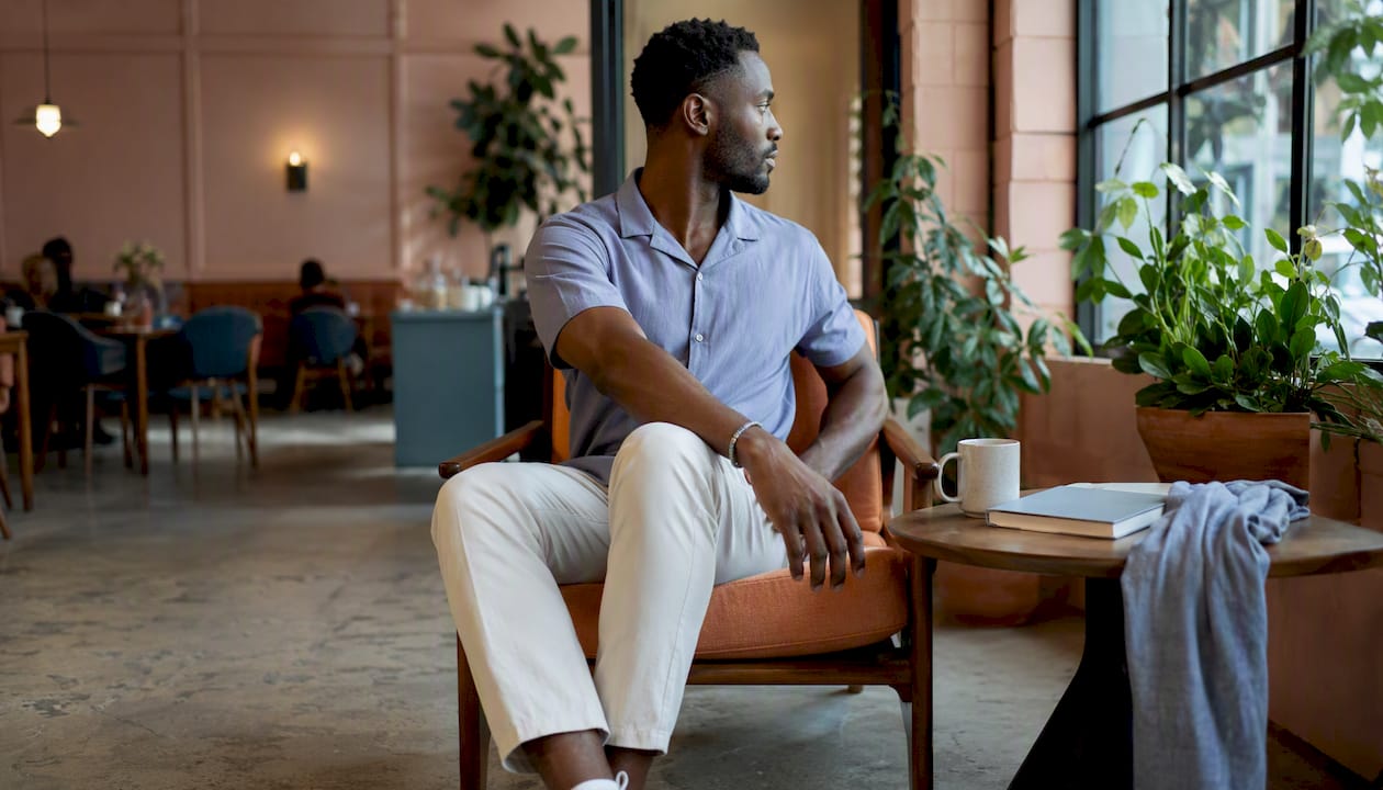 Man doing seated twist stretch at coworking