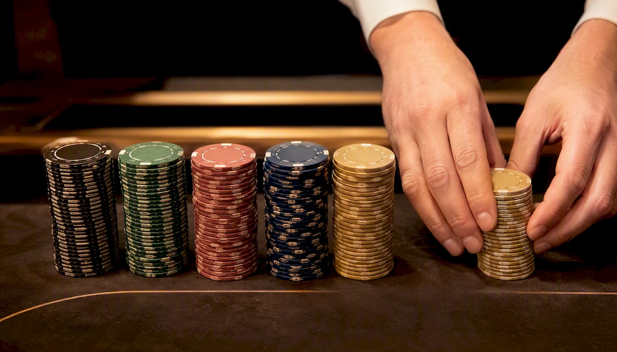 Neatly arranged poker chip stacks on felt