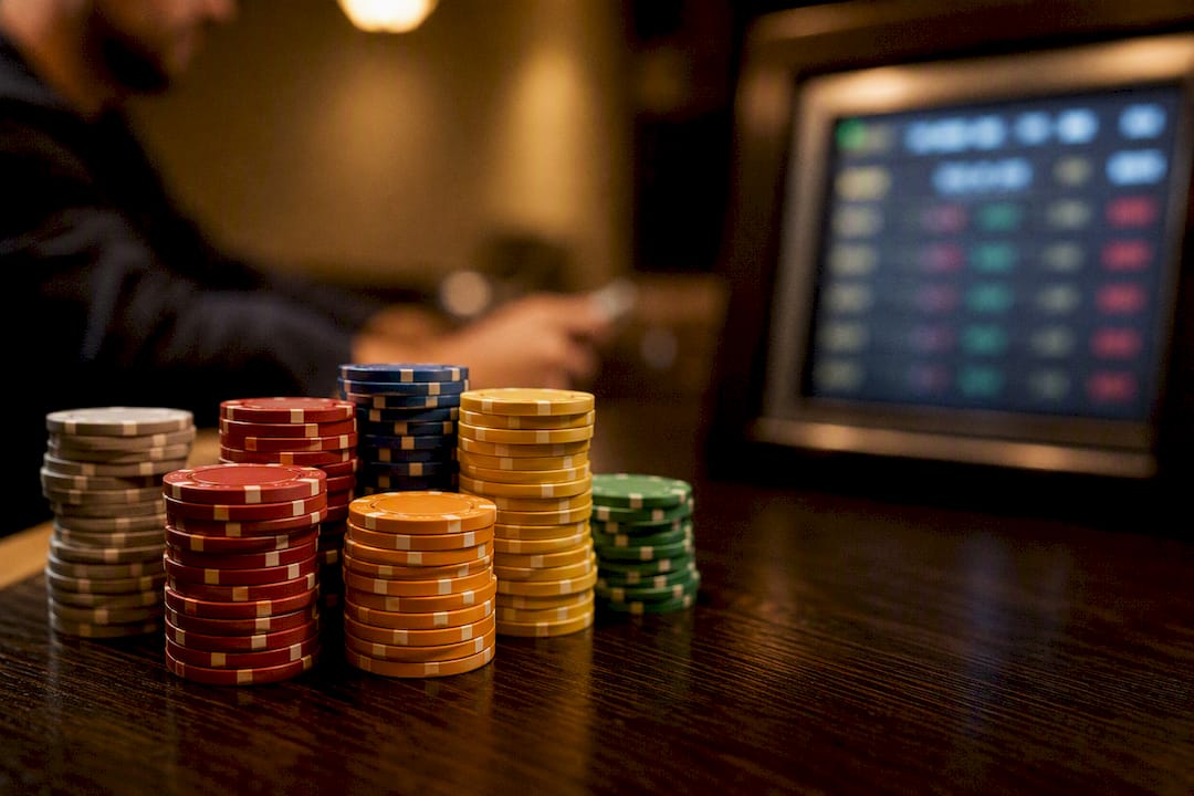 Poker chips with blurred leaderboard display