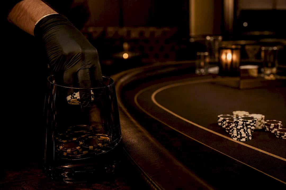Dealer collecting poker rake chips