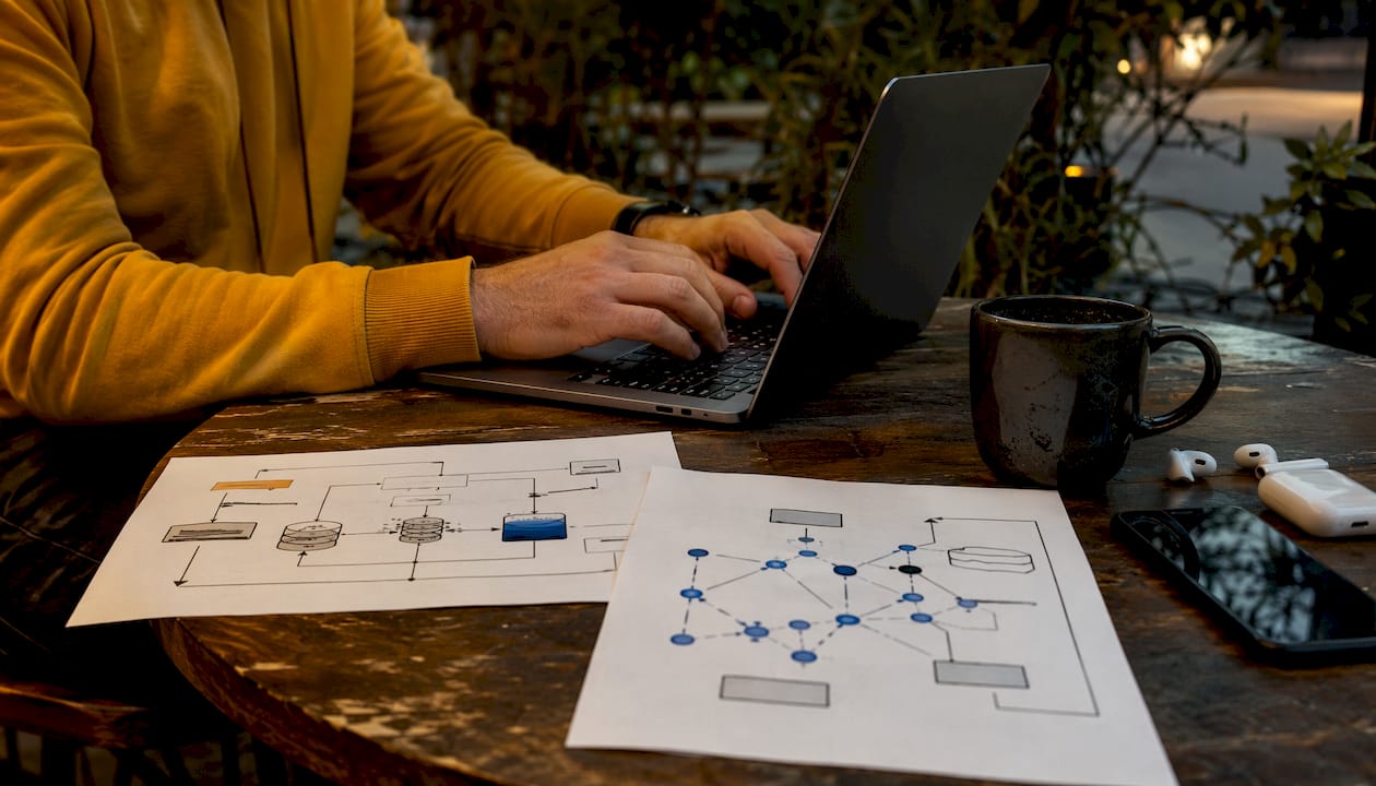 Hands typing near RAG and knowledge graphs diagrams