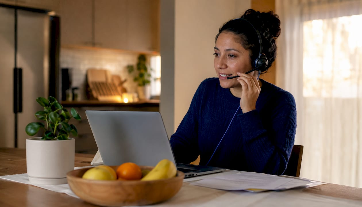 Woman making local presence outbound calls at home office