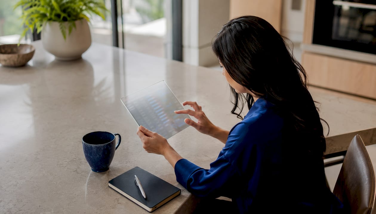 Hands using tablet to review algorithmic order routing