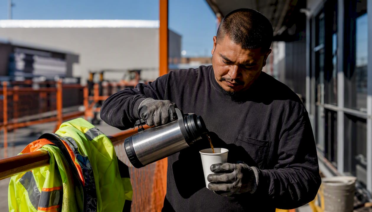 Worker pouring coffee during break