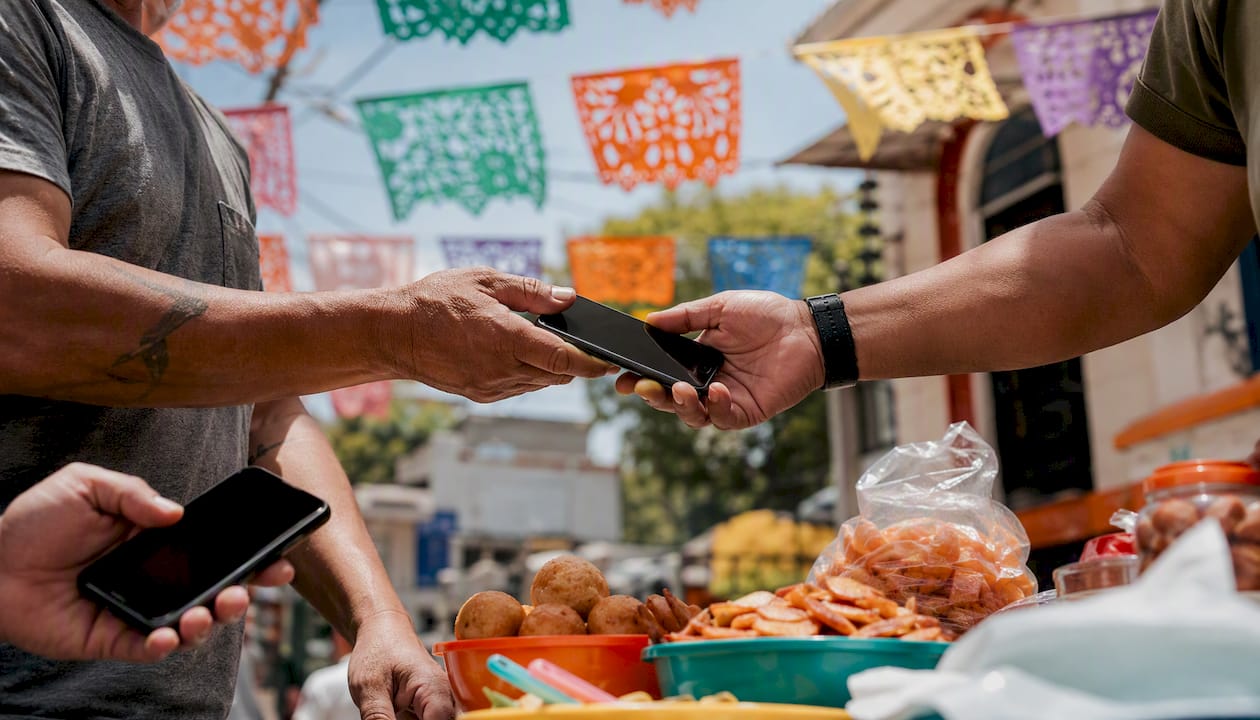 Community gathering with smartphones and decorations