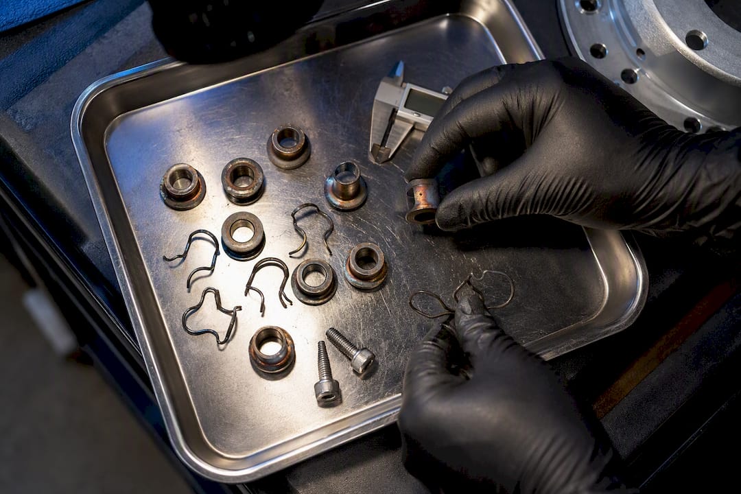 Technician inspecting rotor bobbins and spring clips