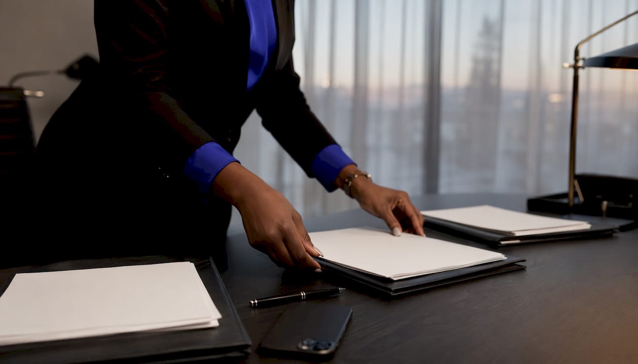 Broker hands organizing loan submission documents