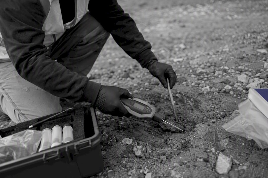 Hands performing environmental assessment with tools