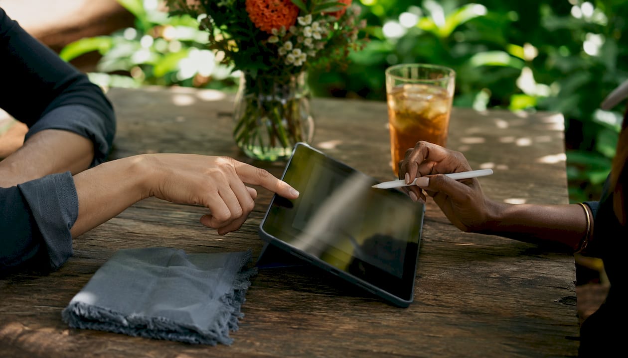 Hands using tablet for online lighting shopping