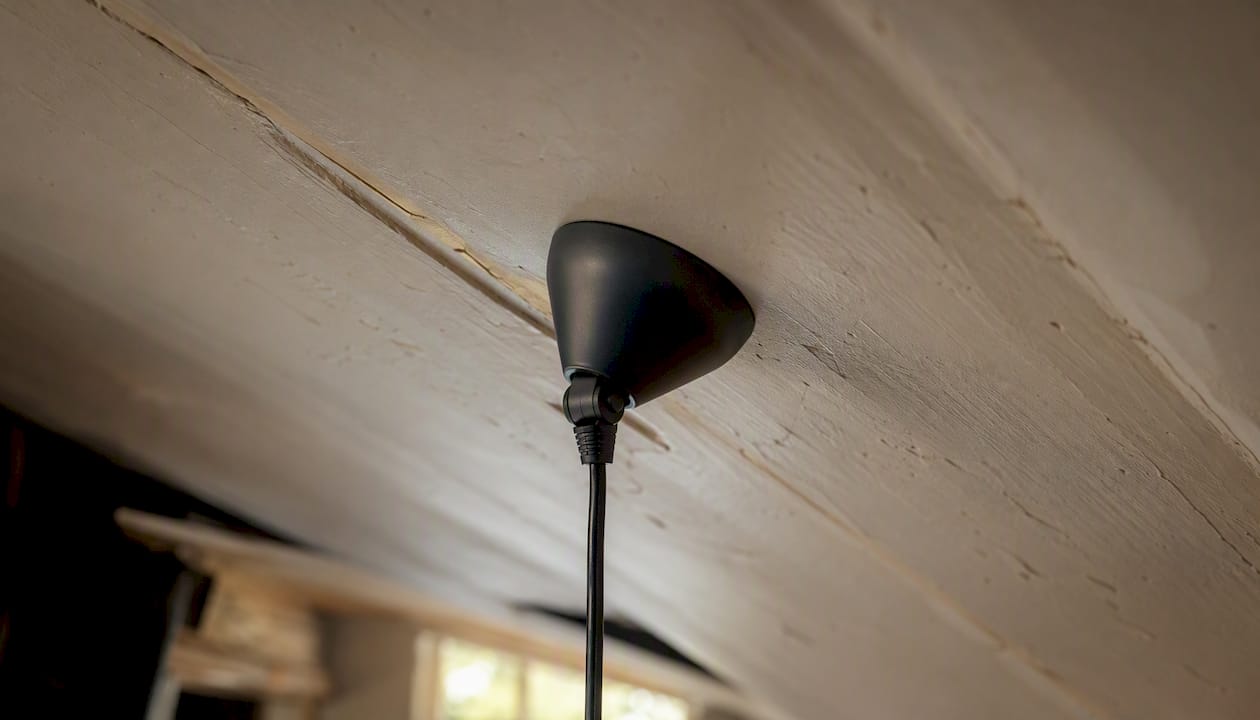 Sloped ceiling canopy hardware on angled surface