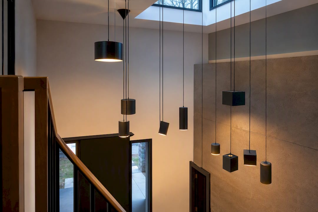 Two-story foyer with varied-height pendant cluster