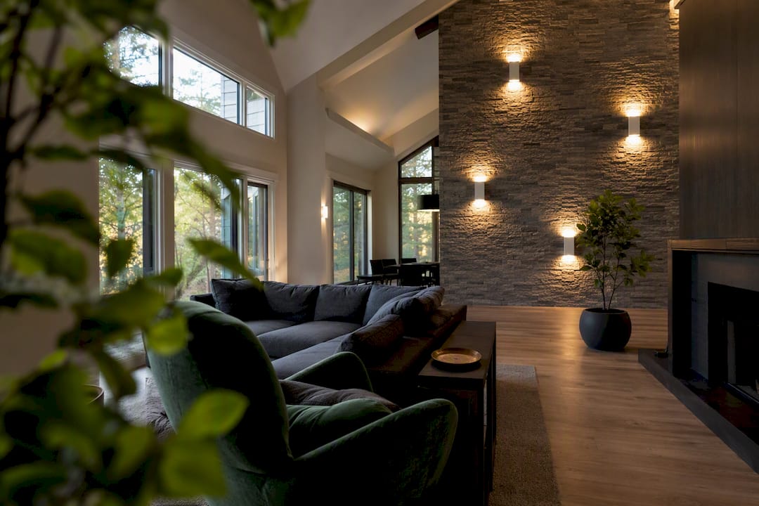 Wall sconces on vaulted ceiling living room wall