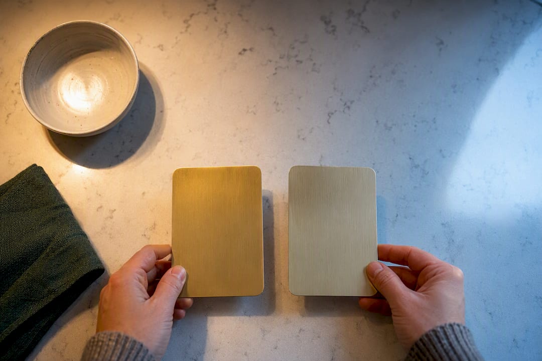 Brass swatches compared under mixed kitchen light