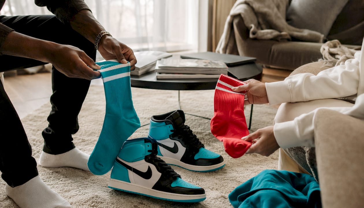Overhead view of hands choosing socks by Jordans