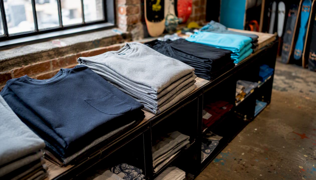 Close-up of folded streetwear apparel with skate shop props