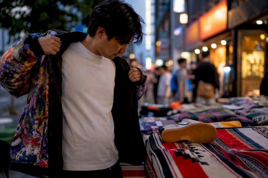 Tokyo sneaker collector adjusting jacket outdoors