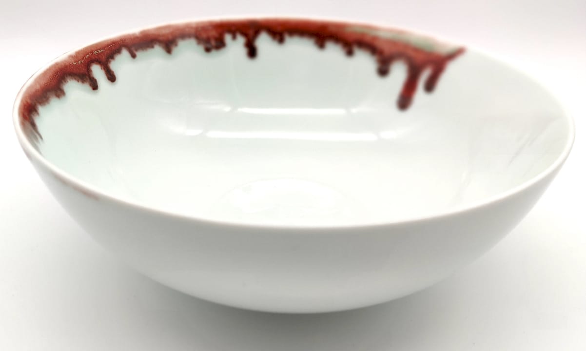 Hand painting underglaze on raw porcelain pottery
