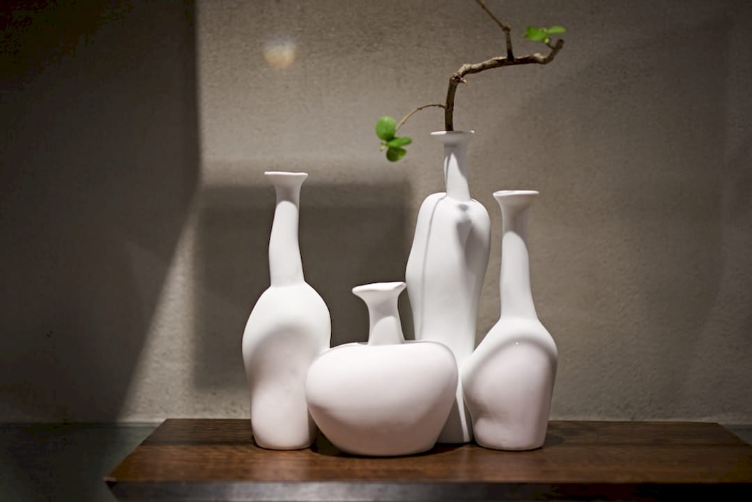 Asian style porcelain decor on wooden shelf