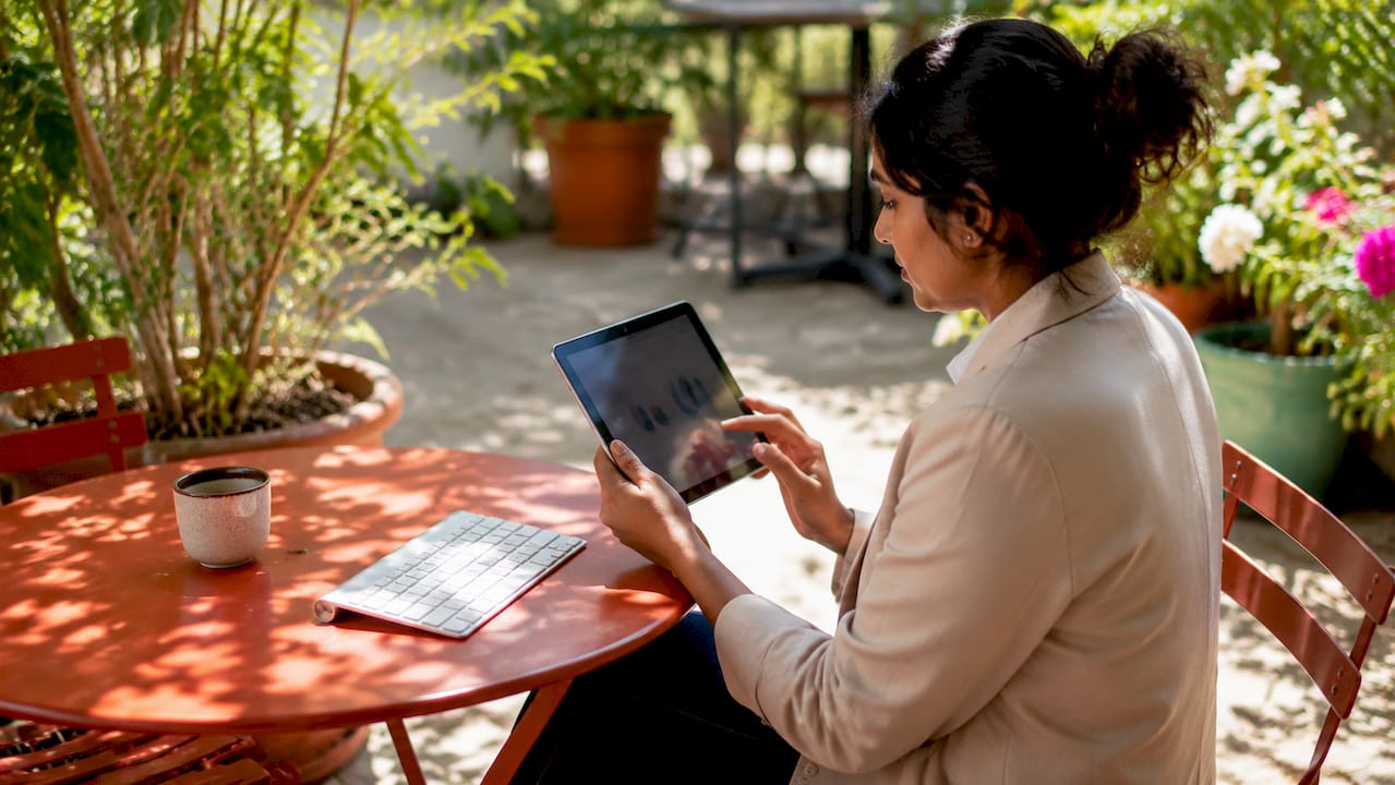 Woman reviewing ecommerce analytics on tablet