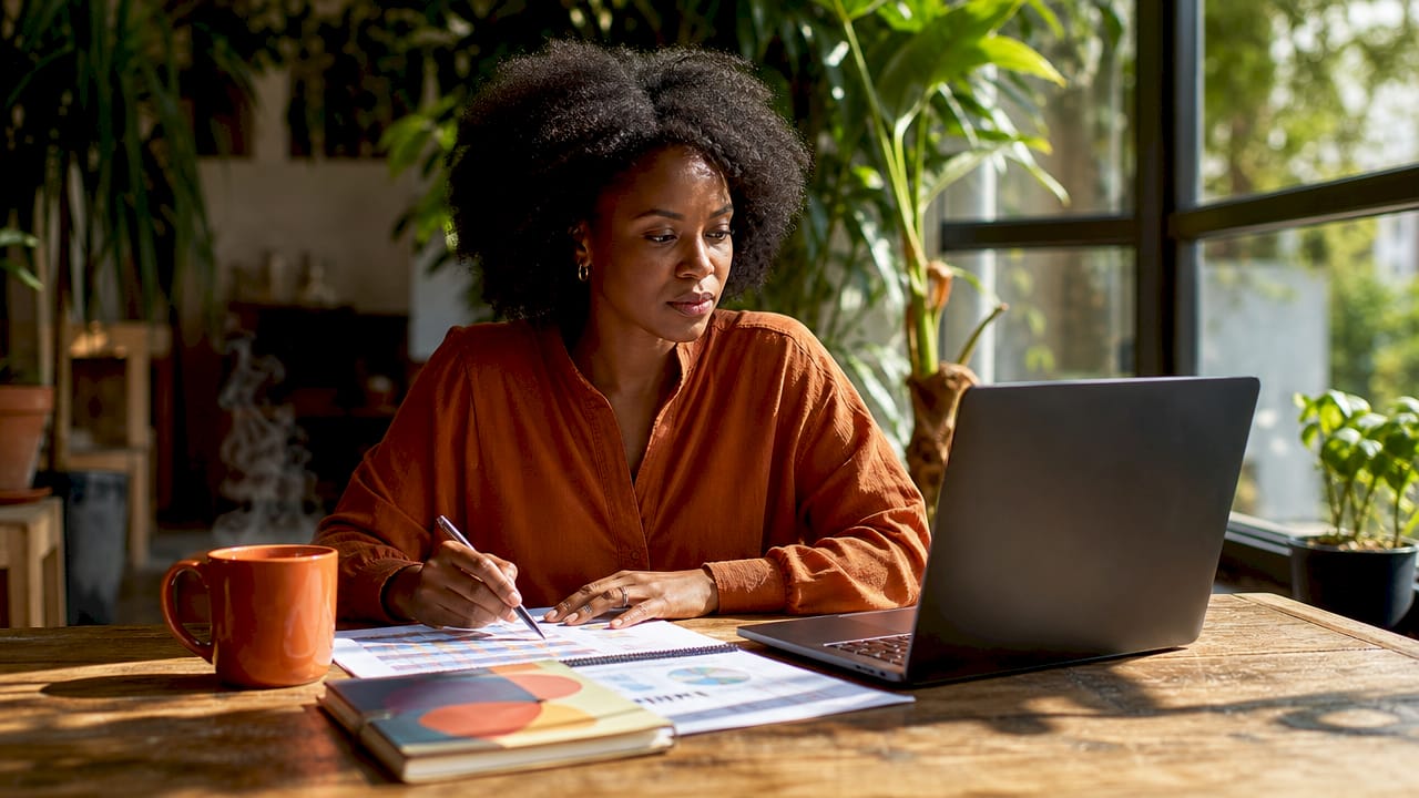 Woman reviewing AI analytics on laptop