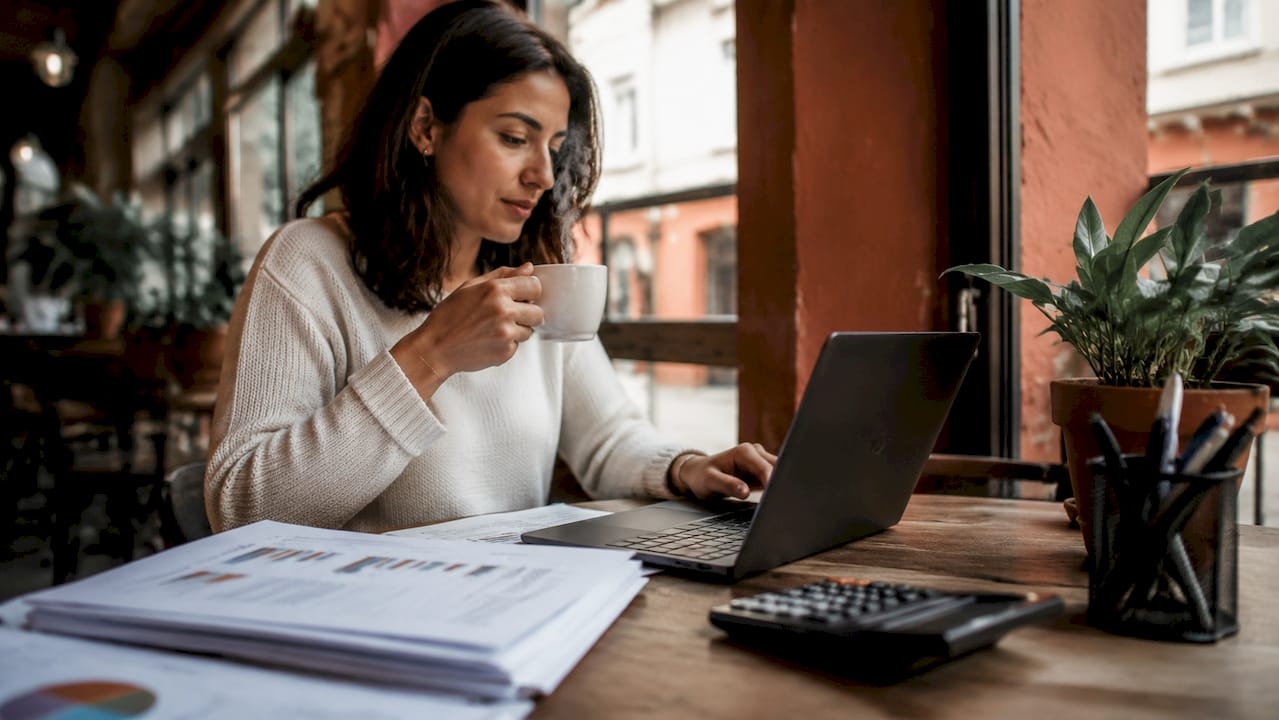 Woman analyzing customer value at workspace