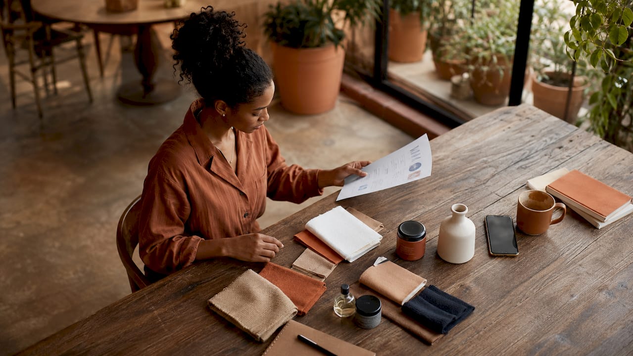 E-commerce manager reviewing customer retention data at desk