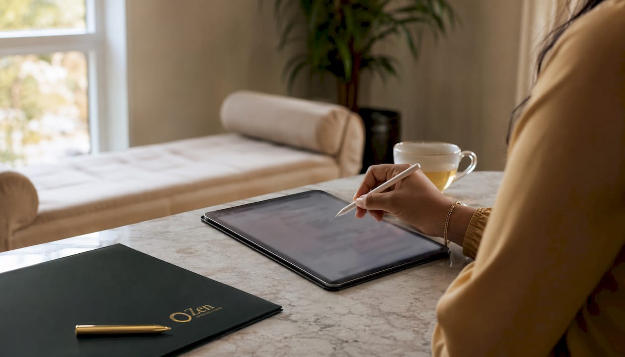 Hand filling psychiatry patient intake form on tablet