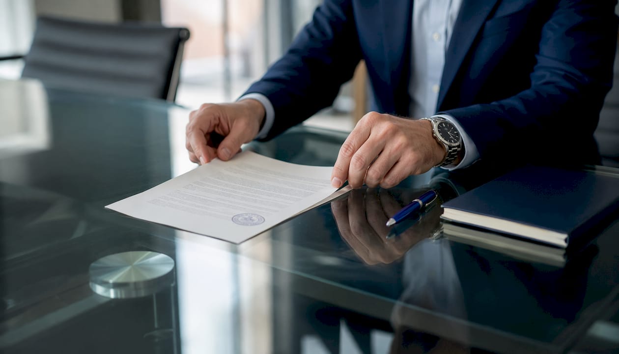 Attorney handling commercial sale contract papers