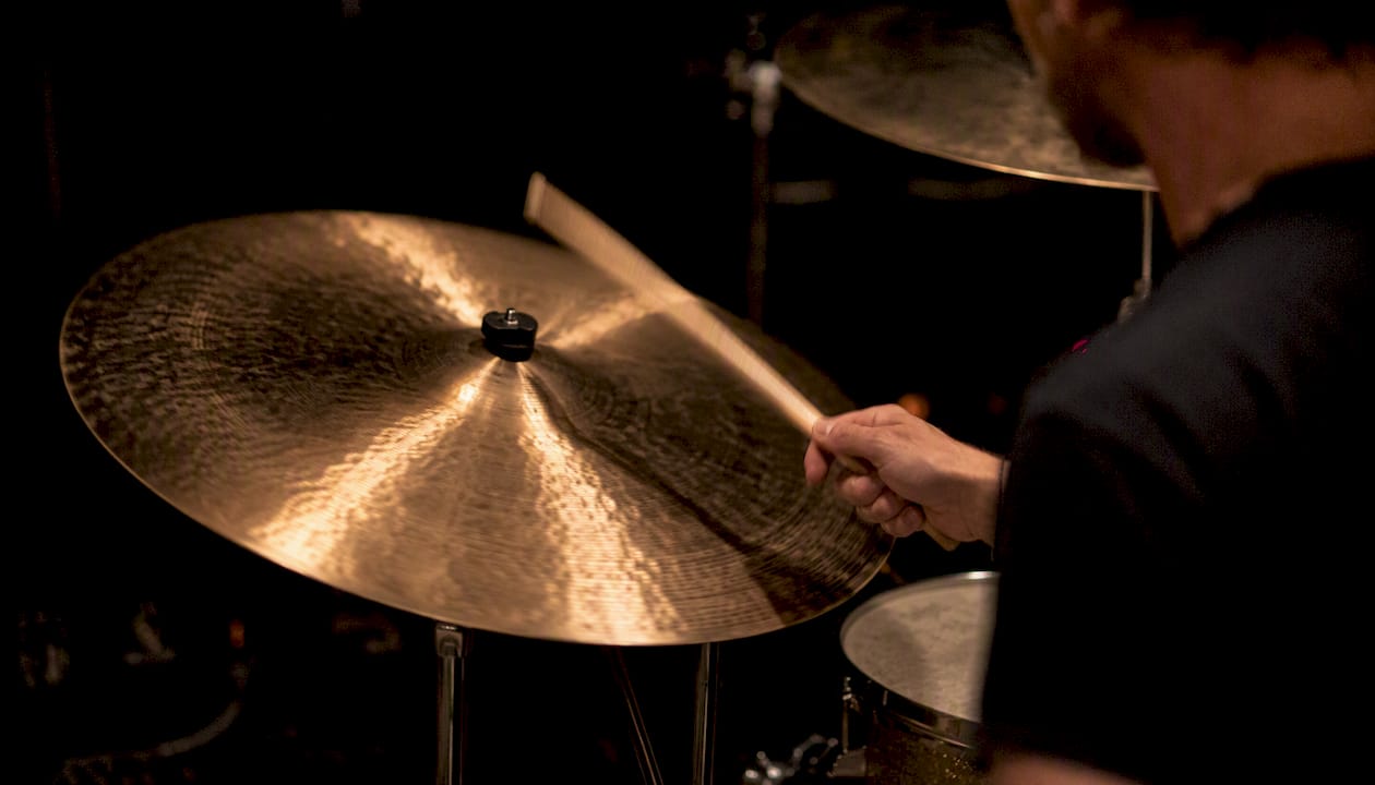 Rock drummer hitting large ride cymbal