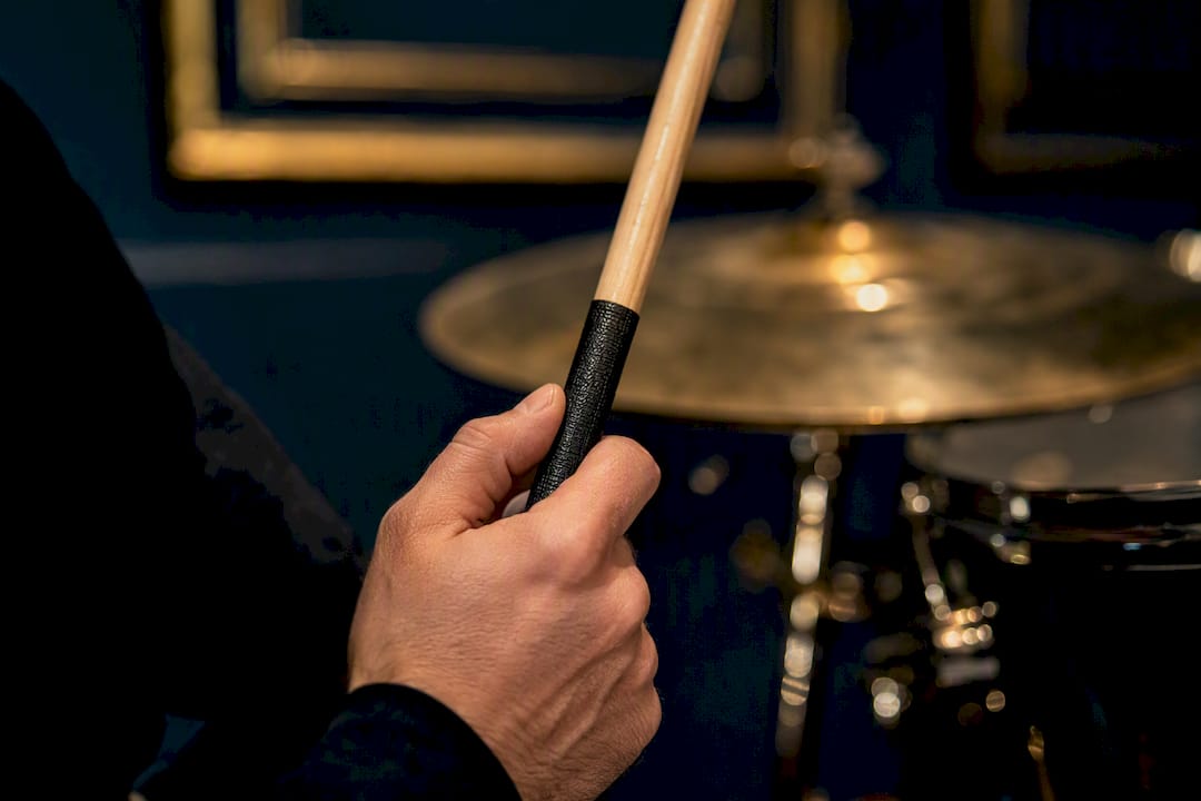 Hand gripping coated drumstick shaft