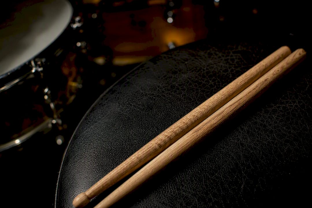 Oak vs Hickory Drumsticks: Which Wood Fits Your Playing?