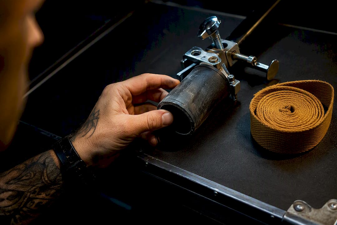 Technician inspecting holder clamp sleeve