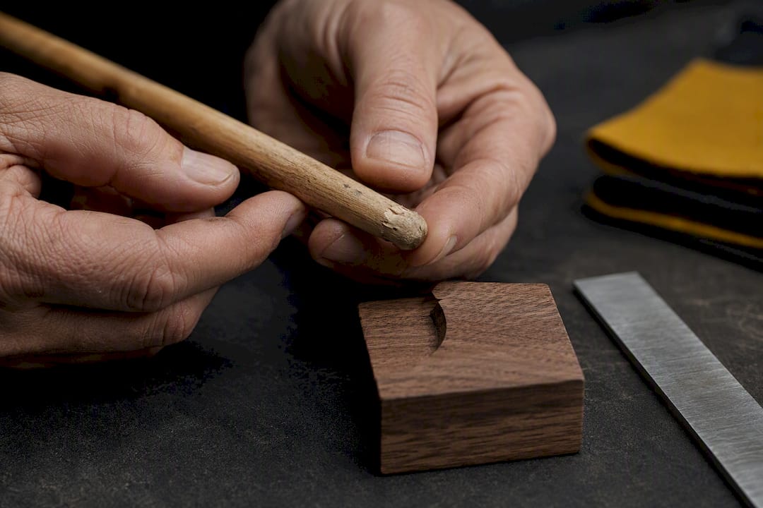 Damaged wood drumstick tip under inspection