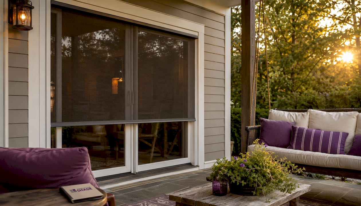 Motorized retractable patio bug screen extended outdoors