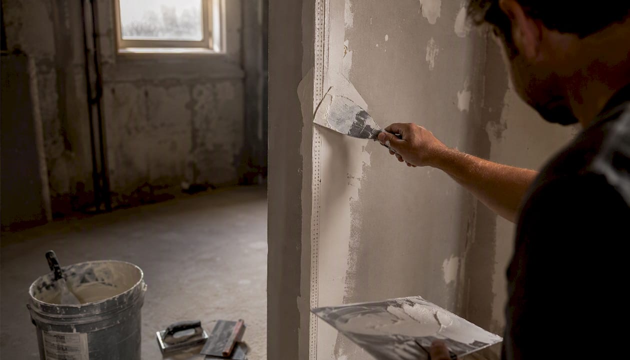 Applying joint compound over paper-faced drywall corner bead